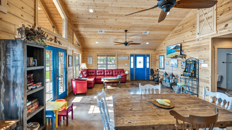 Interior view of the clubhouse/common room with seating and décor — demonstrates indoor guest facilities and the style of the resort's shared spaces (homepage interior photograph).