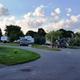 Ground-level view of paved roads and RV sites with parked trailers — good depiction of typical site appearance and driveway layout (sites.jpg).