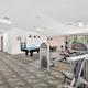 Interior image of the fitness / game room with equipment and pool table — documents indoor amenities available to guests; from the amenities page.