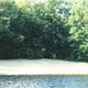 Sandy shoreline and water edge — clear photo of the campground's beach area from the site's main gallery.