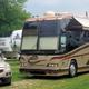 Close view of a large motorcoach and adjacent site showing space and accessibility for big rigs; page context promotes 'Big Rig Friendly' which matches the image.