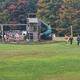 Playground and open lawn with people visible — highlights on-site recreational facilities and family-friendly grounds (photo appears in onsite amenities section).