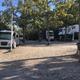 Level gravel RV site with full hook-ups at Branson Shenanigans RV Park
