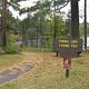Picture of paved trail and sign.