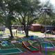 Miniature golf course and nearby cabins/play area — shows another on-site recreational feature and cabin accommodations visible on the campground's activities gallery.