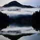 A view of Loon Lake with fog settling in above the lake.