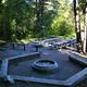 A fire pit and picnic benches at Malad Summit