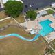 Aerial view of the pool area with a water slide and surrounding deck/chairs — shows a main on-site recreational facility for guests (appears on the resort photo gallery).