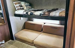 Large RV with outdoor kitchen, fireplace, and TVs