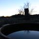 Panoramic image of a cedar soaking hot tub at dusk on the grounds (page title: Rancho Gallina | Inn and Eco-Retreat) — highlights an on-site amenity unique to the property.