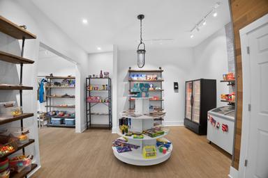 Interior of the camp store / retail area with shelves and coolers — demonstrates guest amenities available on-site (from the site photo gallery).