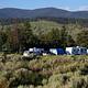 Trucks and trailers in a group campsite.