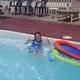 Pool photo showing a swimmer and the pool deck — demonstrates on-site pool amenity; sourced from the campground's amenities/gallery images.