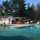 Clear, well-framed photo of the campground pool and poolhouse area — a core amenity. Source: site hero/amenities image on the campground homepage.