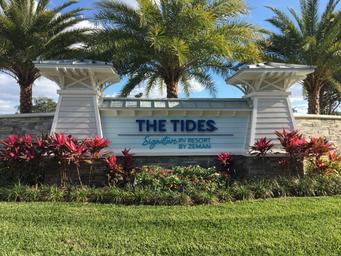 Photograph of the resort entrance sign and landscaping identifying the property and entry experience — suitable for property gallery (gallery page).