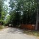 Wide view of Paw Paw's RV Park with asphalt roads and shade trees