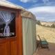 Clear exterior shot of a named yurt (Willow) on its private deck with surrounding landscape — good for showing on-site accommodations and decking/views; image is from the property’s Luxury Yurts page.