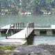 Small courtesy dock on the water—depicts on-site access to the lake and typical dock facilities for visitors.