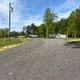 Approach road through the park with RVs visible on the crest — provides a wider view of the campground circulation and setting (gallery page).