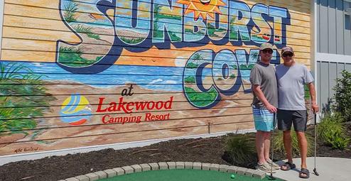 18‑hole mini golf image with Lakewood branding mural in the background — a distinct on‑site activity shown on the Amenities page.
