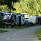 Close view of large RVs parked at full-hookup sites along a paved road — illustrates big-rig capable sites and typical spacing (source: Big Rig Sites page).