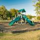 Playground area with slides and swings — depicts family-friendly on-site amenities; originates from the campground's image set on the website.