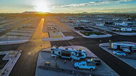Aerial view of Buckeye Ranch RV Resort at sunset — overnight RV park near I-10 in Tonopah, Arizona, with full-hookup sites and easy interstate access.