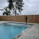 Photo of the property swimming pool being maintained; shows on-site amenity and fencing — useful to represent park facilities (uploaded on site).