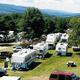 Aerial view of RVs and campsites with surrounding landscape — matches ‘Campgrounds’ image on the amenities page (shows overall layout and RV pitches).