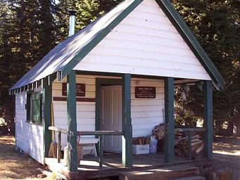 Front of white and green cabin