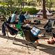 Tent campers relax at a picnic table at Sunset Campground