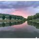 Scenic lakeside view at sunset with RVs reflected in the water — useful for showcasing the campground’s waterfront setting (Overview page image).