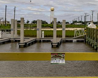 Marina docks and slips on water with numbered pilings — depicts the property's dock/marina facilities (image used on the site as Lighthouse Bend Marina).