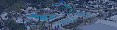 Wide landscape image of the waterpark area (slides, pools, deck space) providing a clear on-site amenity shot referenced on the Waterpark amenities page.