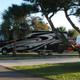 Row of RVs and paved sites with landscaping — clear photo of RV pitches/campsites useful to show available site types. Listed on the site as campground photography.