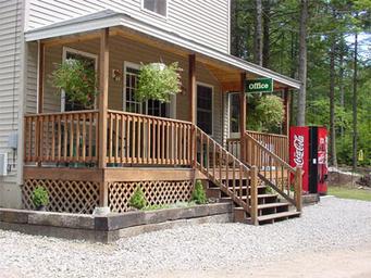 Office building entrance with porch and vending machines — shows on-site office/guest services area; from the Testimonials/contact context on the site.