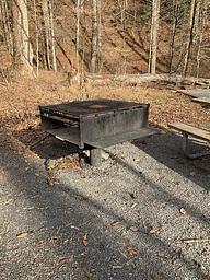 Large metal cooking grill at campsite