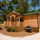 Cabin exterior with picnic table and grill — useful to show on-site cabin lodging; matches cabin imagery used on the park website.