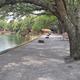 Lakeside walkway and picnic/seat areas on the campground waterfront; matches hero image on the property page showing the lakefront setting and docks.