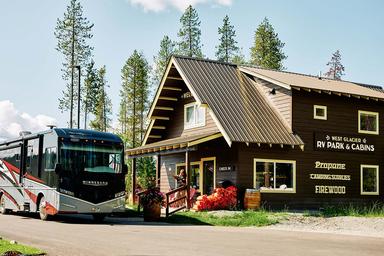 Entrance/office building with RV parked nearby — identifies the park’s check-in/amenity building and entrance area from the site gallery.