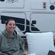 Panoramic crop showing guests seated in front of a large RV, highlighting campsite setup and amenities (outdoor seating area) — from the property homepage (Granberry Gardens LLC).
