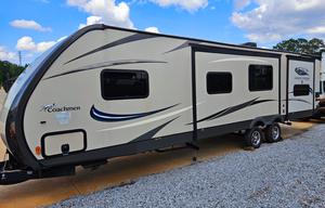 Large RV with outdoor kitchen, fireplace, and TVs