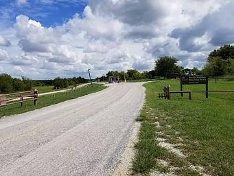 Paved driveway leading to North Holiday Park entrance