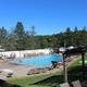 Guests swimming and relaxing at the heated outdoor pool