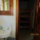 A bathroom sink across from the bunk beds.