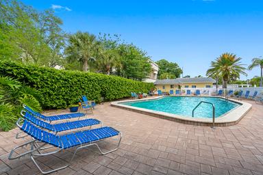 Outdoor swimming pool and deck with lounge chairs — shows on-site recreational facilities. Labeled Pool on the gallery page.
