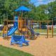 Ground-level photo of the children’s playground within the campground — highlights family-friendly on-site play area (site image labeled playground).