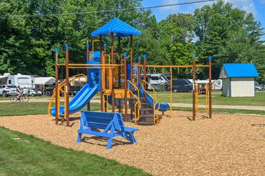 Ground-level photo of the children’s playground within the campground — highlights family-friendly on-site play area (site image labeled playground).