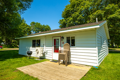 White cabin at The Red Door Resort on Mille Lacs Lake