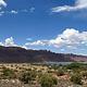 Overview of Ken's Lake Campground with red rock cliffs lining the horizon.
